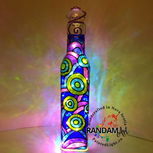 Abstract circles and lines of blues, greens and purples hand painted bottle light.